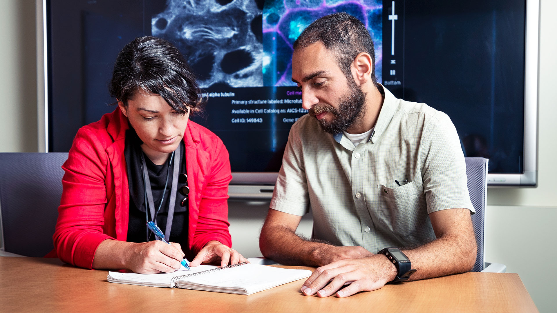 Cell biologists at the Allen Institute work on a project.