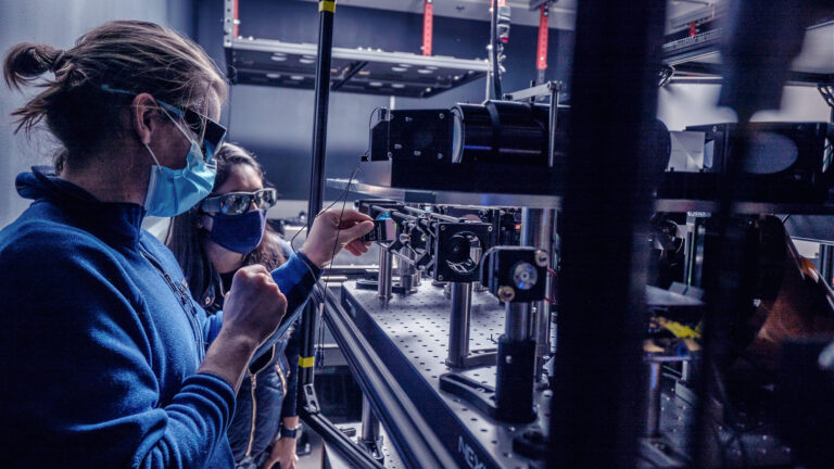 Researchers setting up an experiment at the Allen Institute for Neural Dynamics