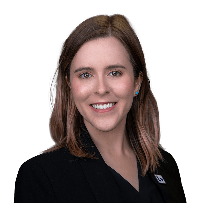 Woman smiles at camera.
